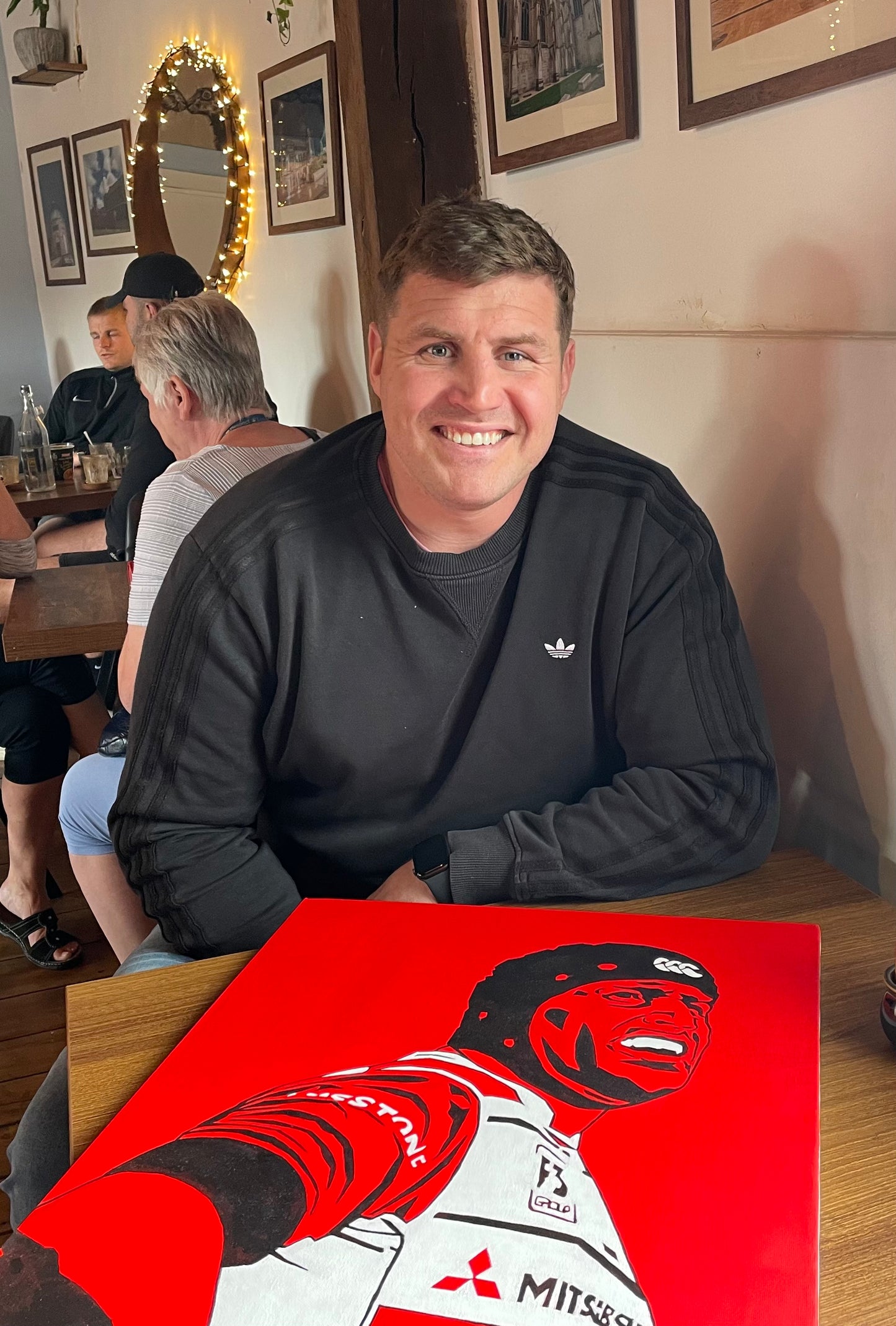 Ben Morgan with his pop art players original portrait painting